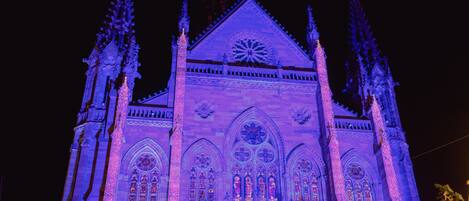 A Gothic-style building with pointed arches and a large rose window.