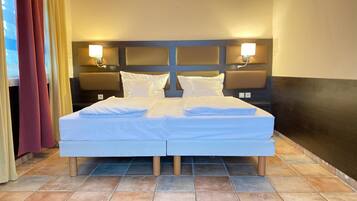 Down duvets, memory-foam beds, in-room safe, desk