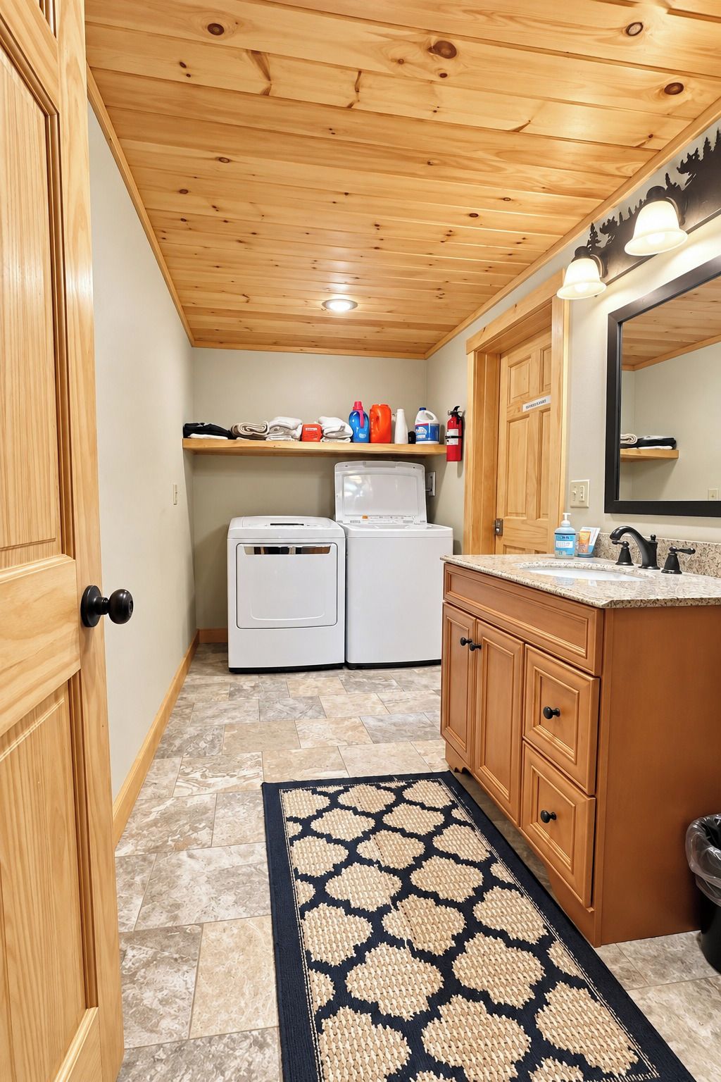 A compact kitchen with wooden cabinets, a countertop, and a built-in washing machine.