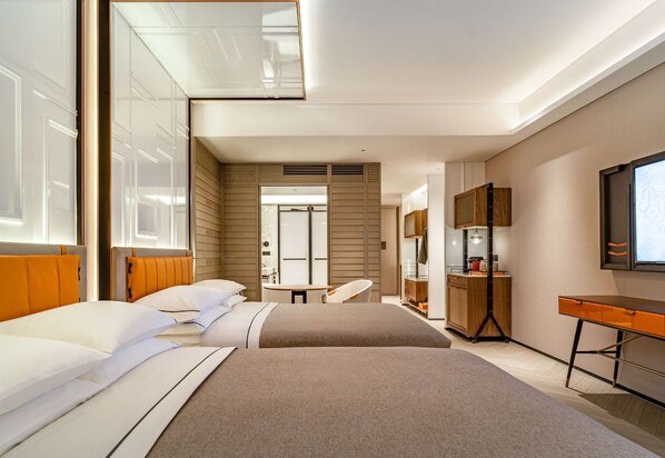 A modern hotel room with two beds, a desk, a mirror, and a TV. - Canopy by Hilton Hangzhou West Lake (Hangzhou)