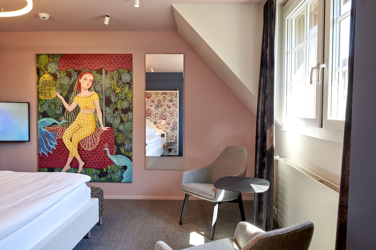 boutique double room | living area | 22-inch flat-screen tv with satellite channels, tv