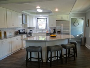 Kitchen (threshold at right gives access to backyard & laundry/2nd bathroom)