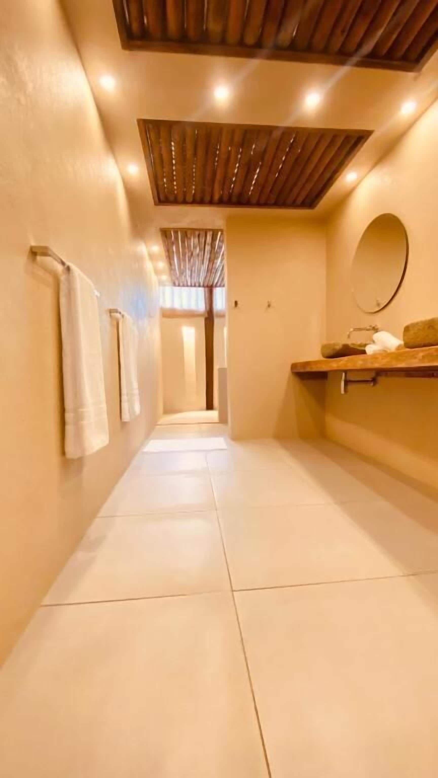 family house | bathroom | shower, rainfall showerhead, designer toiletries, towels