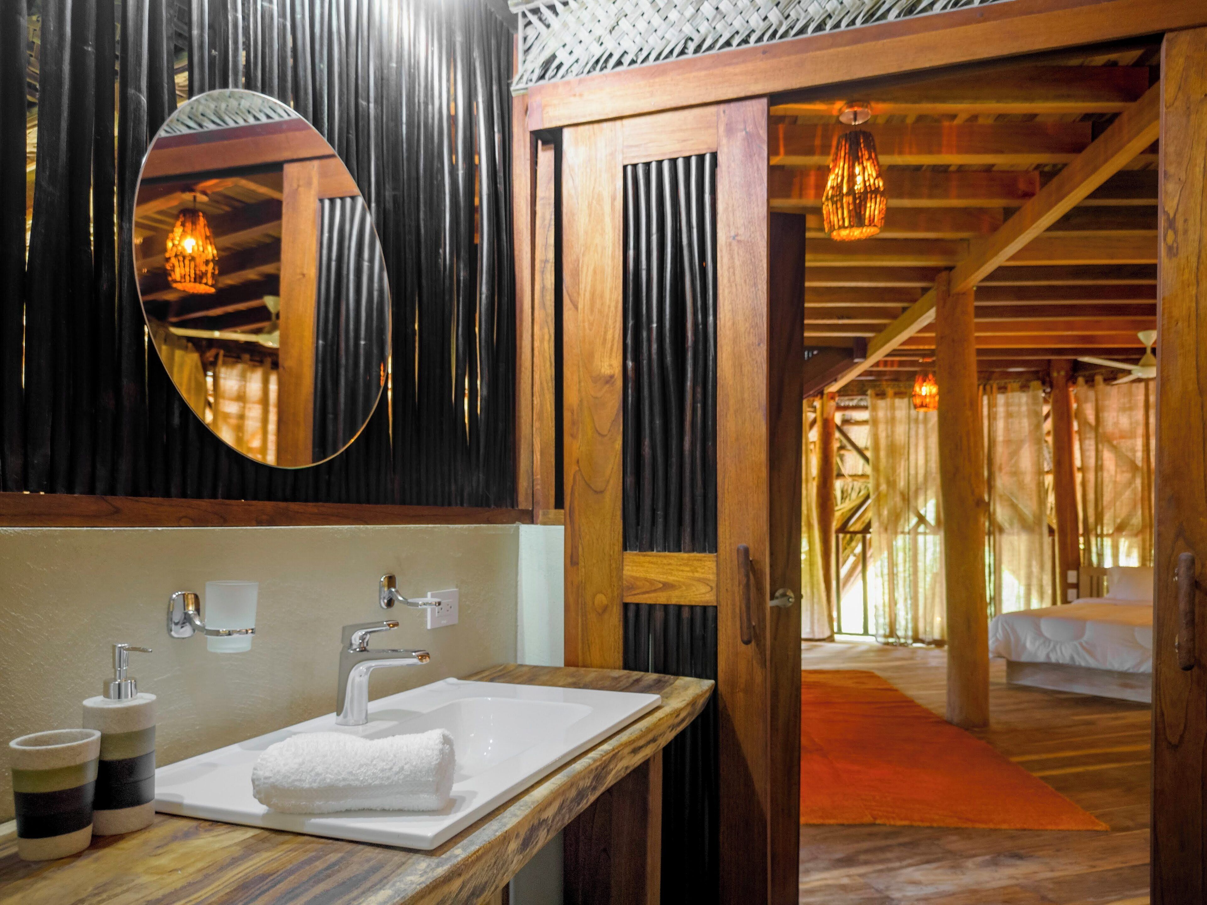 family suite | bathroom | shower, rainfall showerhead, designer toiletries, towels