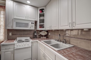 Coffee/tea maker, fridge, microwave, oven - Ground-Floor 1BR with King Bed, Heated Pool & Beach Access (St. Pete Beach)