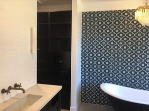 Bathtub, hair dryer, towels, soap