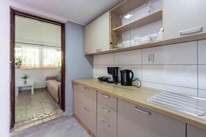 Villa | Private kitchen | Fridge, microwave, oven, stovetop