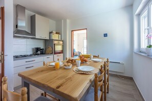 Villa | Private kitchen | Fridge, microwave, oven, stovetop