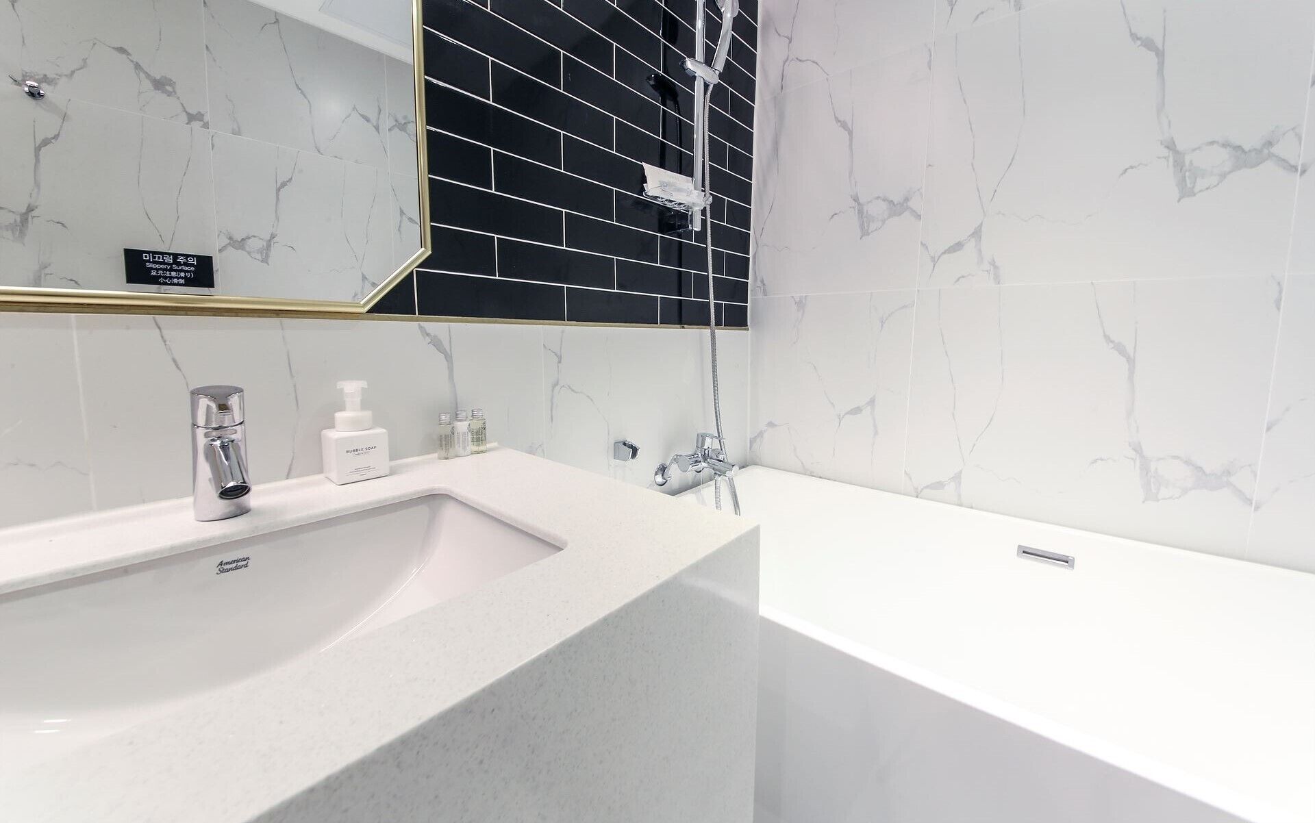 deluxe double room (netflix) | bathroom | designer toiletries, hair dryer, bathrobes, slippers