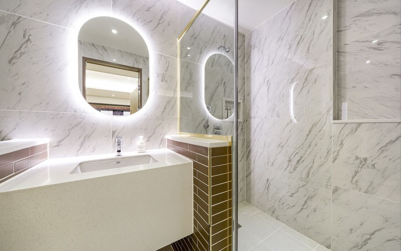 family suite, ocean view (spa, netflix + styler + air purifier) | bathroom | designer toiletries, hair dryer, bathrobes, slippers