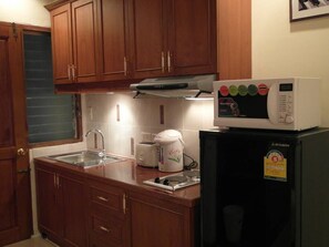 Condo, 1 Bedroom | Private kitchen | Microwave, electric kettle, dining tables