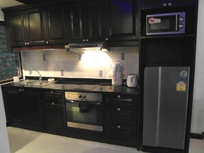 Condo, 1 Bedroom | Private kitchen | Electric kettle, dining tables