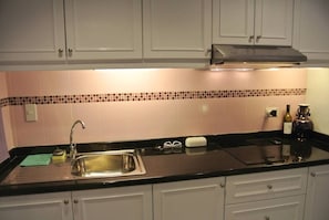 Condo, 1 Bedroom | Private kitchen | Microwave, electric kettle, dining tables