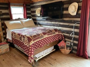 1 dormitori, caixa forta a l'habitació i planxa i posts de planxar 