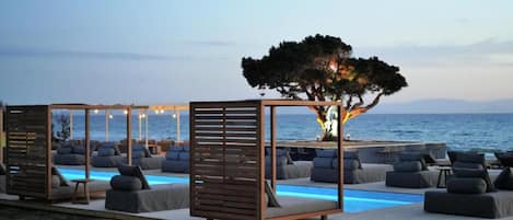 Deluxe Room, 1 Bedroom, Sea View, Beachfront | In-room safe, individually decorated, desk, blackout curtains