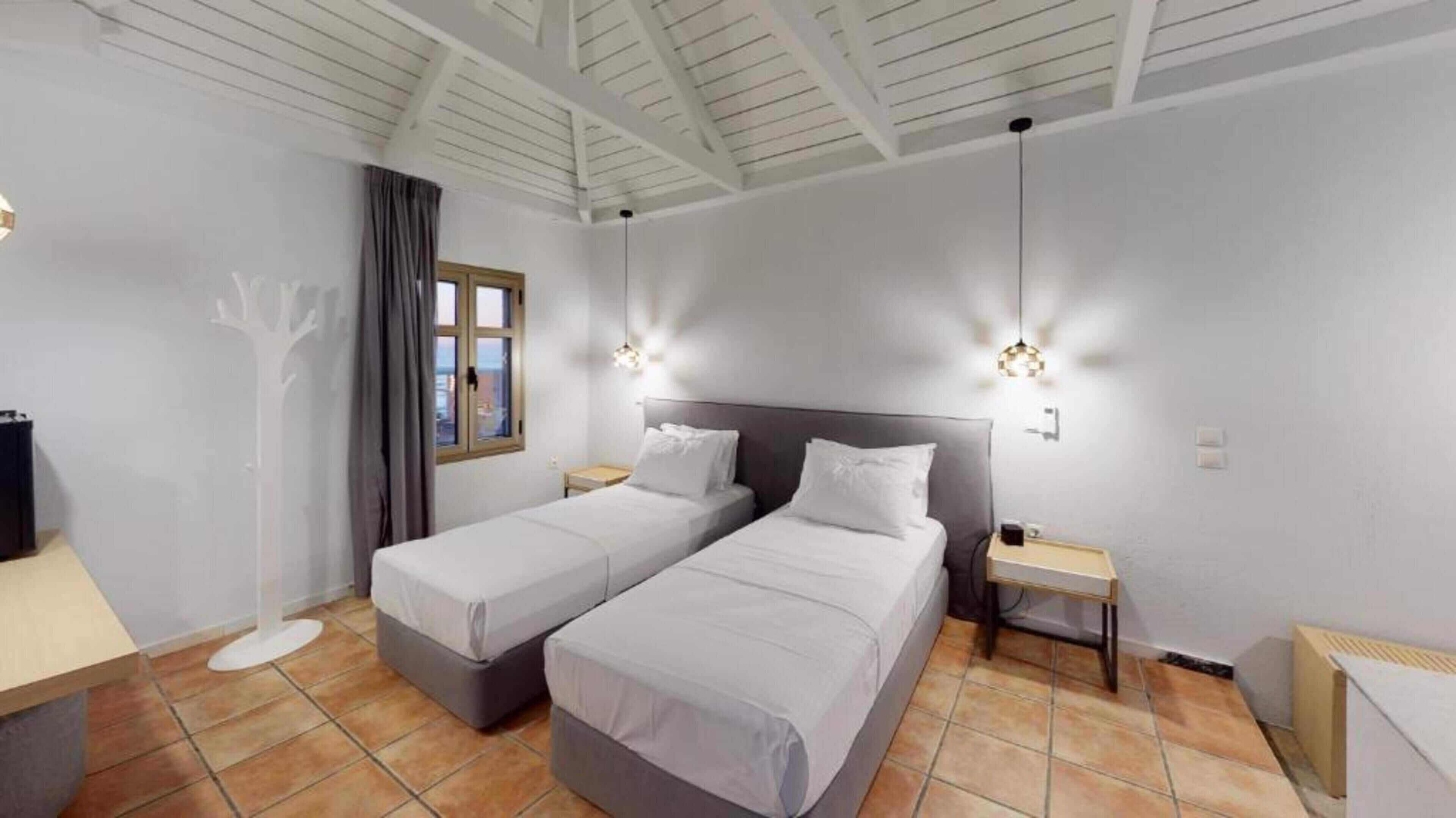 Deluxe Room, 1 Bedroom, Sea View, Beachfront | In-room safe, individually decorated, desk, blackout curtains