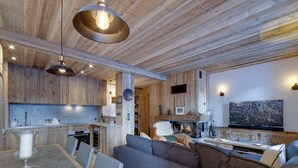 A modern interior with a kitchen, dining area, and living room.