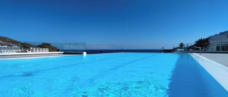 Outdoor pool, open 7:00 AM to 8:00 PM, pool umbrellas, sun loungers