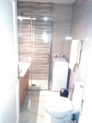 Hair dryer, towels, soap, toilet paper
