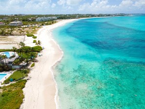 Overlooking the beach, this resort offers stunning views of the turquoise waters and lush greenery.
