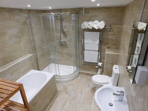 Bathtub, hair dryer, towels