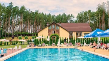 Indoor pool, seasonal outdoor pool, pool umbrellas, pool loungers