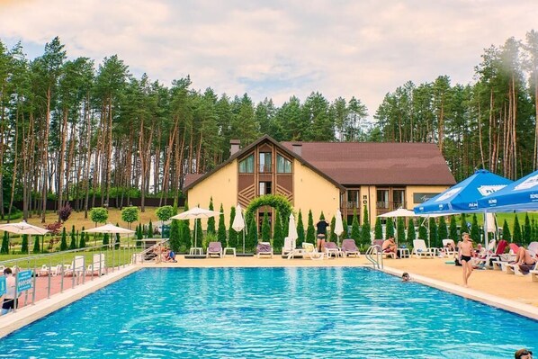 Indoor pool, seasonal outdoor pool, pool umbrellas, pool loungers