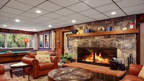 A cozy lounge area with leather sofas, a billiards table, and a stone fireplace. - Endless Family Fun @ Private LUX Retreat Sleeps 25 (Annville)