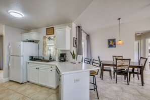 Fridge, stovetop, dishwasher, coffee/tea maker