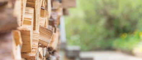 A close-up of stacked wooden planks, likely part of a structure or construction.