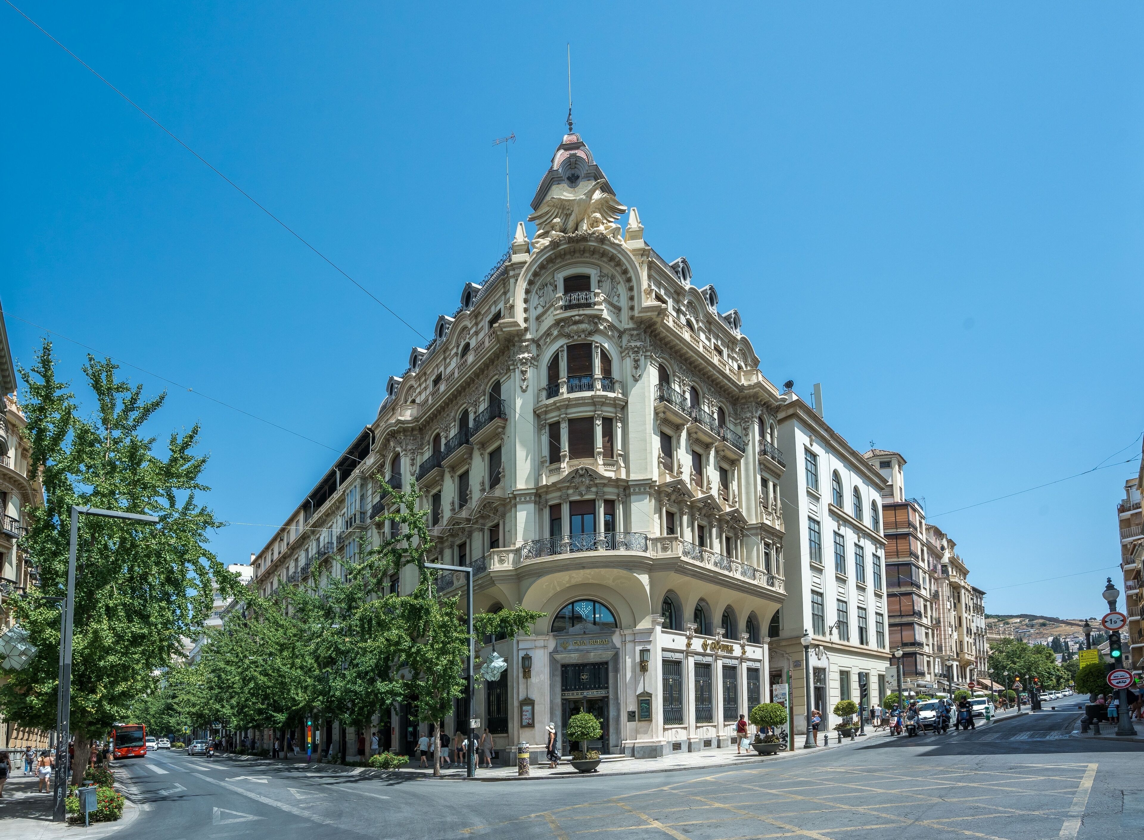 A historic building with ornate architecture, large windows, and a prominent entrance.