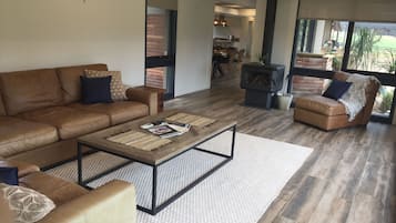 TV, fireplace, books, printers