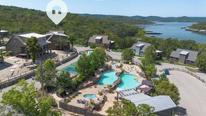 A resort with multiple swimming pools, a dock area, and a view of a lake. - Poolside Cabin #13 Luxury 3 bedroom - Perfect Family Retreat for 8 people. (Kimberling City)