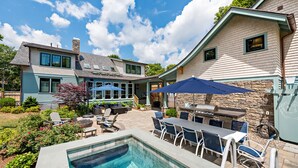 A two-story house with a backyard patio, a swimming pool, and outdoor furniture. - The "Idea House" From TV Series This Old House! High End, Definition of Luxury! (Narragansett)