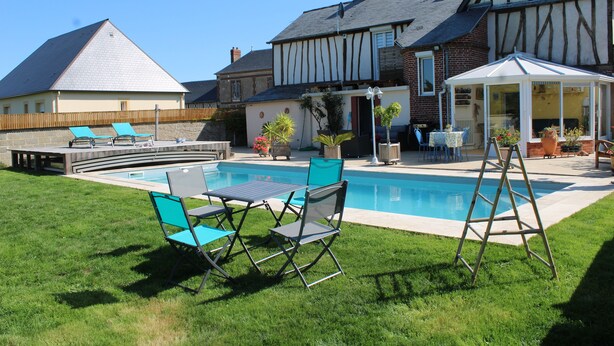 A backyard with a swimming pool, a covered patio, and a lawn with outdoor furniture. - Detached house in an 18th-century property. (Mesnil-en-Ouche)