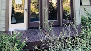 A building named "Rainbow Villas" with large windows and a wooden deck in front. - Rainbow Villas 1 Charming Boutique complex, Dual Master Suites, Forest Mountain Views by RedAwning (Mammoth Lakes)