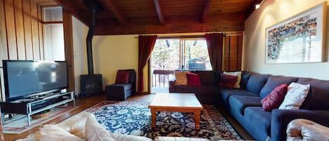 Condo, 4 chambres | Aire de séjour