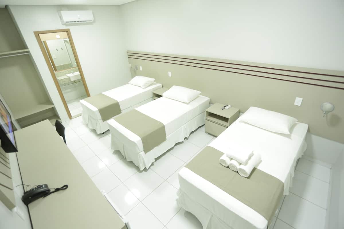 standard triple room | 1 bedroom, pillow-top beds, minibar, in-room safe