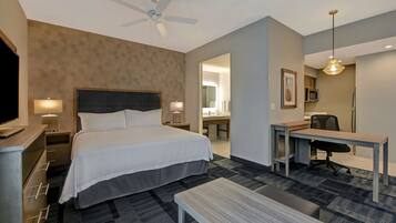 Hypo-allergenic bedding, desk, laptop workspace, blackout drapes