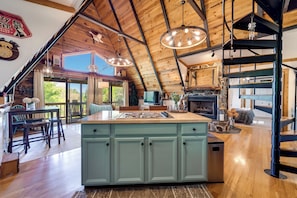 Enjoy cooking in this well-lit kitchen with ample counter space and a central island.