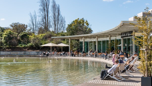 A waterfront area with a pool, lounge chairs, and a covered seating area. - FLH Best of Principe Real Liberdade in the Heart o (Lisboa ciudad)