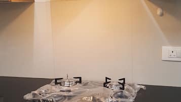 Fridge, microwave, stovetop, cookware/dishes/utensils