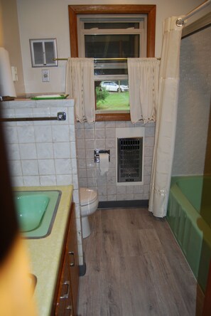 Combined shower/tub, hair dryer, towels, soap