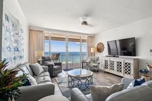 Enjoy ocean views from the balcony and relax in the comfortable seating area with a sofa and armchairs.
