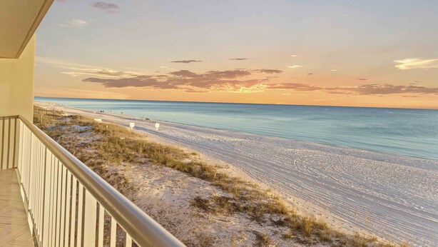 A beach view from a balcony with a railing, sandy beach, and ocean. - Destin Gulfgate 0206, Beachfront Condo in Heart of Destin! (Destin)