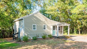 A single-story house with a front porch and a small attached garage. - Serene & Quiet Cottage | Office | 5 Min to RH (Rock Hill)