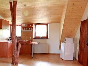 Microwave, oven, freezer, dining tables