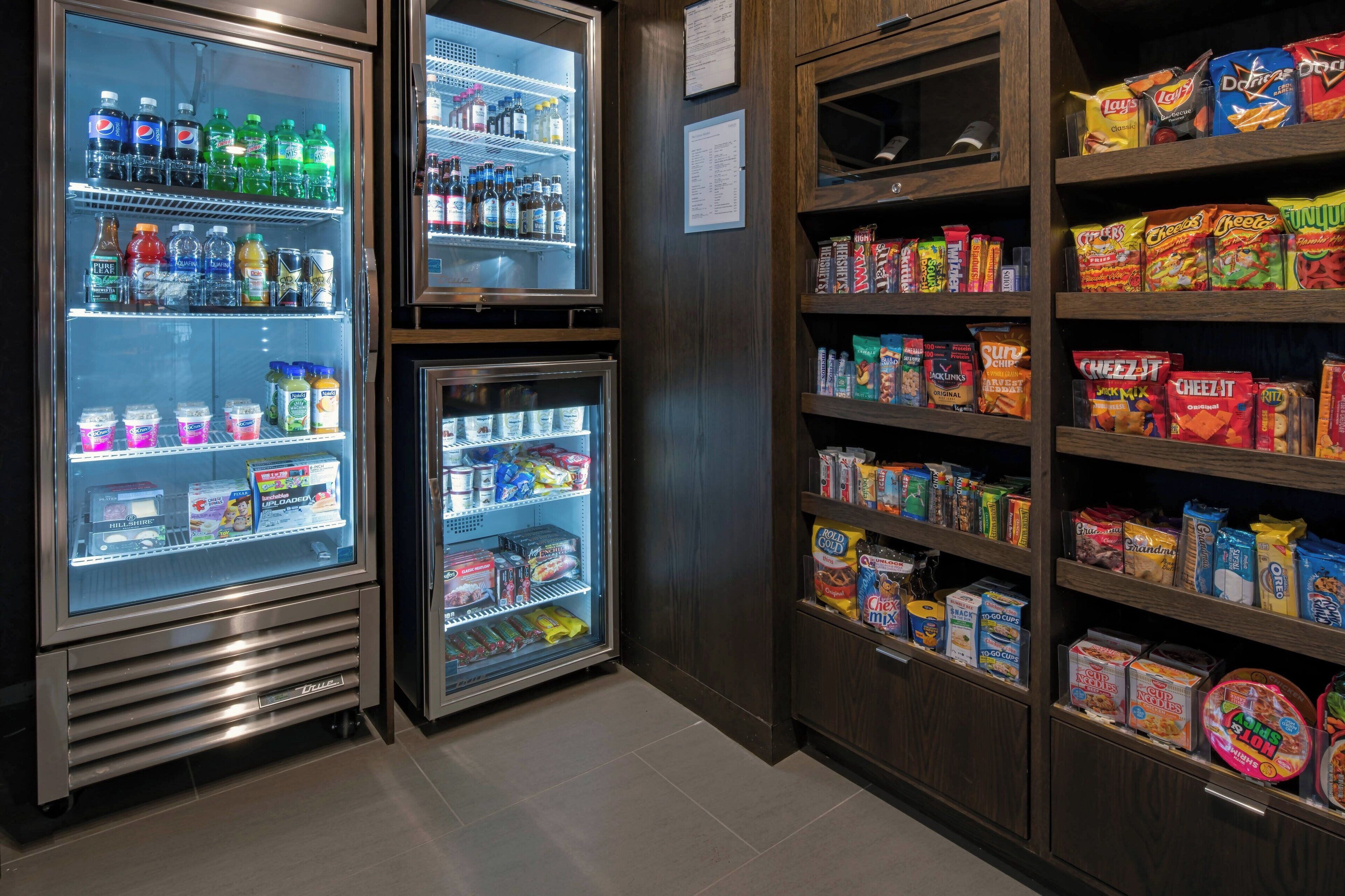 A vending machine area with various snacks and beverages.