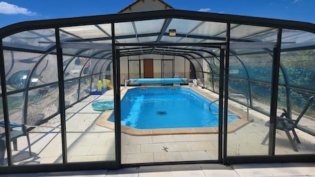 Outdoor pool, a heated pool. Petite Maison de Campagne Avec Piscine Couverte et Chauffée