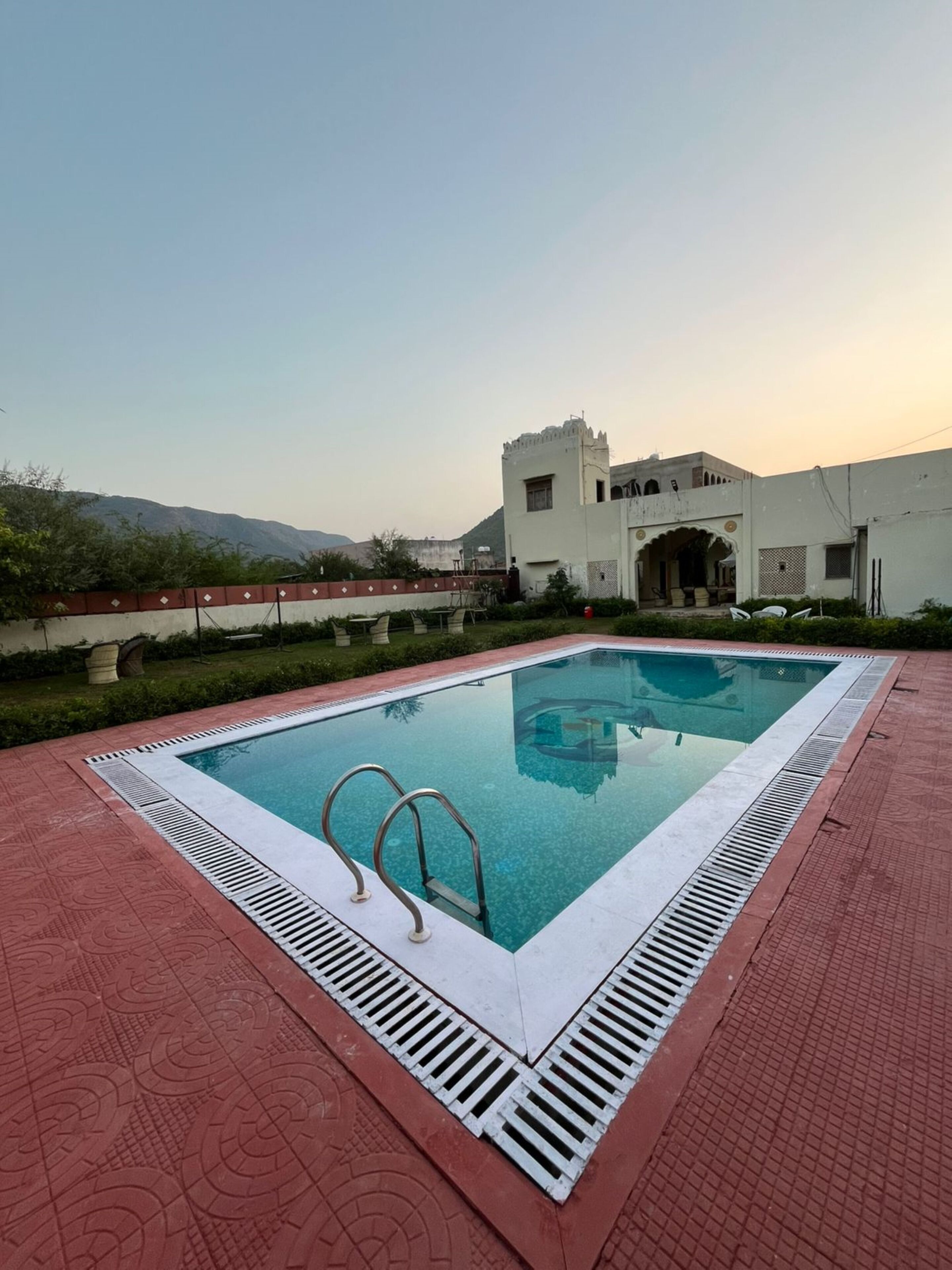 Outdoor pool, open 6:30 AM to 8:00 PM, pool loungers